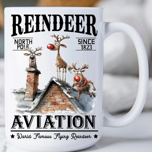 Mug with reindeer design and text on a white background