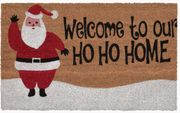 Doormat with Santa Claus illustration and 'Welcome to our HO HO HOME' text on a brown background.