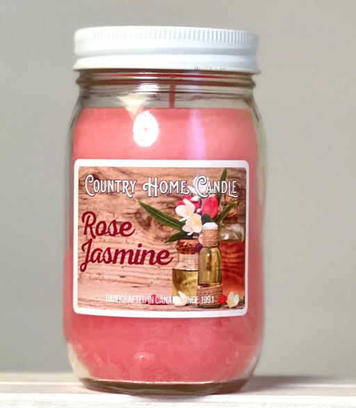 Jar of 'Rose Jasmine' candle with a label on a neutral background