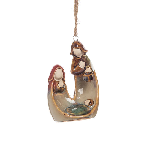 Ceramic nativity scene ornament with a shepherd and lamb on a white background