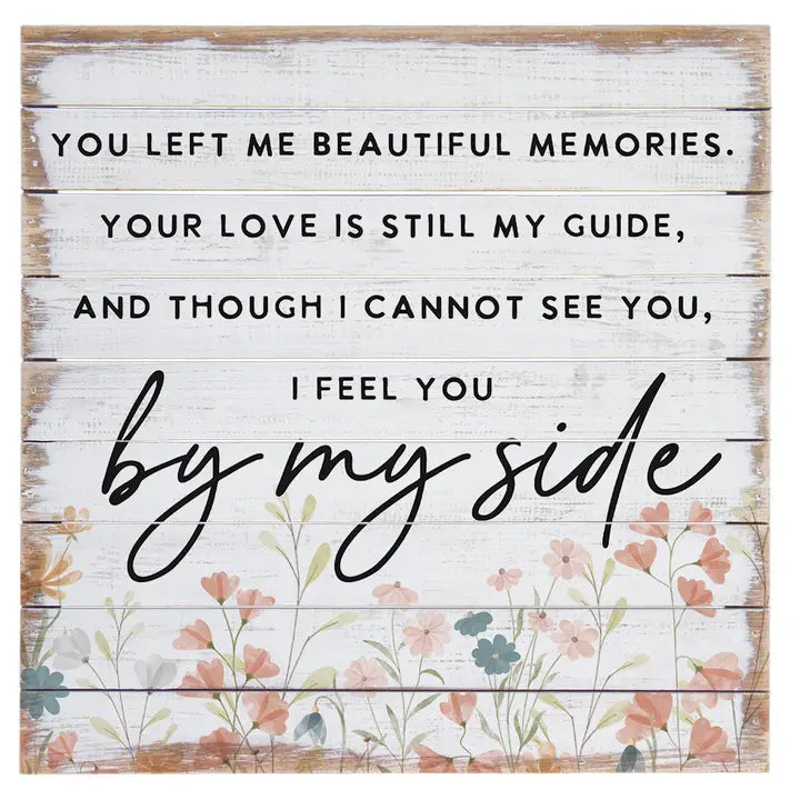 Wooden sign with floral design and text about memories and love