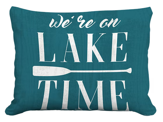 Teal pillow with 'We're on Lake Time' text and paddle graphic