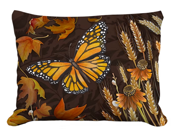 Decorative pillow with butterfly and autumnal design on a brown background