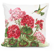 Decorative pillow with floral and hummingbird design on a white background