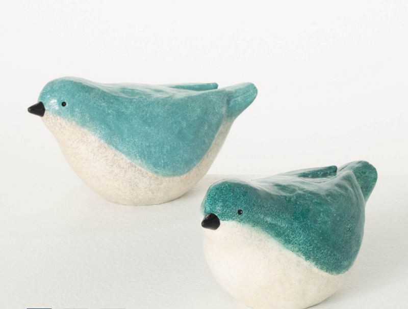 Two ceramic bird-shaped planters with teal and white designs on a white background