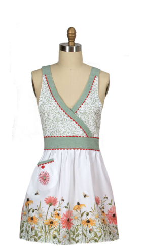 White dress with floral pattern on a mannequin against a white background