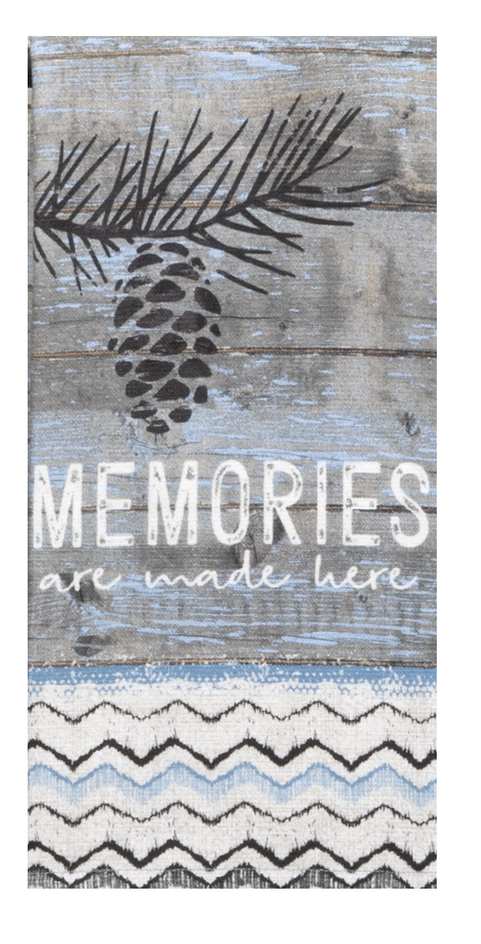 Decorative sign with pine cone and branch design on a wooden background with 'Memories are made here' text.
