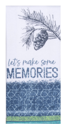 Tea towel with pine cone design and text 'Let's make some memories' on a blue and white patterned background.