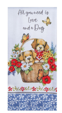Towel with two puppies in a basket, flowers, and butterflies with text 'All you need is love and a dog'.