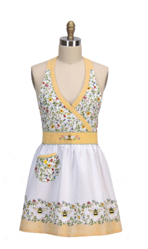 Floral apron with bee design on a mannequin against a white background