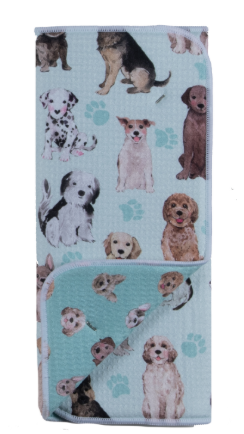 Folded towel with dog pattern on a light blue background