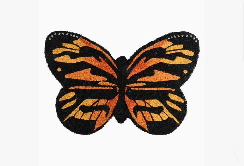 Butterfly-shaped doormat with orange and black pattern on a white background