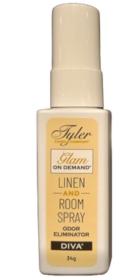 A bottle of Tyler Candle & Co. Linen & Room Spray in 'Diva' fragrance, with a white label and gold accents.