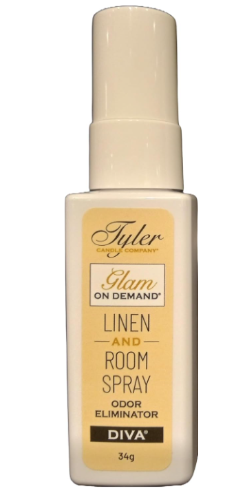 A bottle of Tyler Candle & Co. Linen & Room Spray in 'Diva' fragrance, with a white label and gold accents.