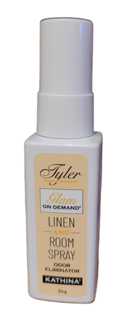 A bottle of Tyler Candle & Co. Linen & Room Spray in 'Diva' fragrance, with a white label and gold accents.