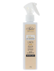 A bottle of Tyler Candle & Co. Linen & Room Spray in 'Diva' fragrance, with a white label and gold accents.