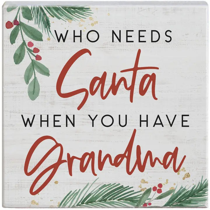 Decorative sign with Christmas-themed text 'Who needs Santa when you have Grandma' on a white background.
