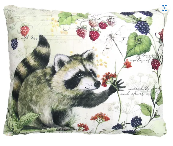 A decorative pillow featuring an illustration of a raccoon surrounded by various berries, with a green and white background.