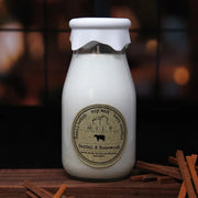 Bottle of milk with a label on a wooden surface