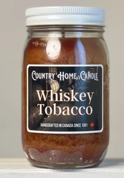 Jar of Country Home Candle Whiskey Tobacco candle on a neutral background