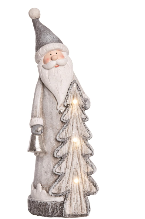 Decorative figure of a Santa Claus with a lit Christmas tree on a white background