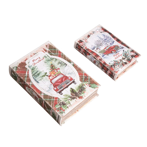 Two packages of Christmas-themed paper with a red truck and trees design on a white background.