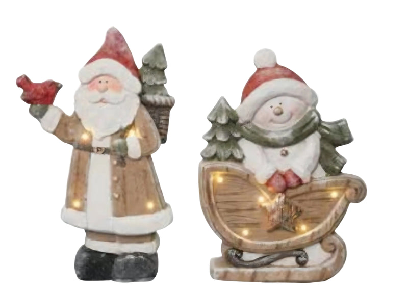 Two light-up Christmas figures, one of Santa Claus and one of a snowman on a sled, on a white background.