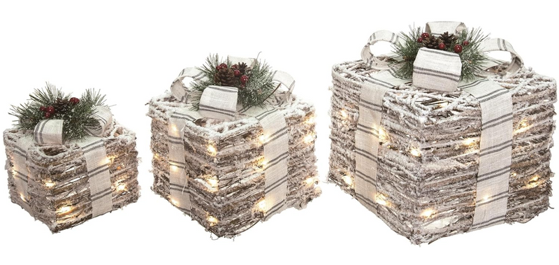 Decorative boxes with lights and greenery on a white background