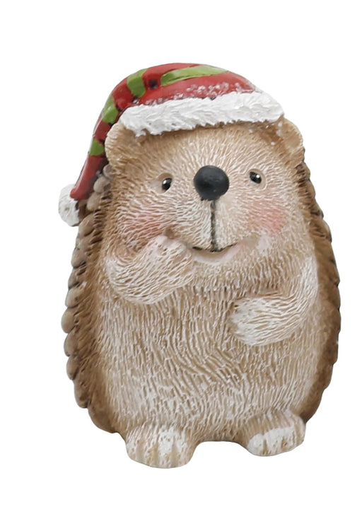 Hedgehog figurine with a Christmas hat next to a wooden crate of smaller hedgehog figurines wearing Santa hats.