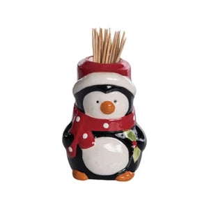Penguin-shaped toothpick holder with a red scarf on a white background