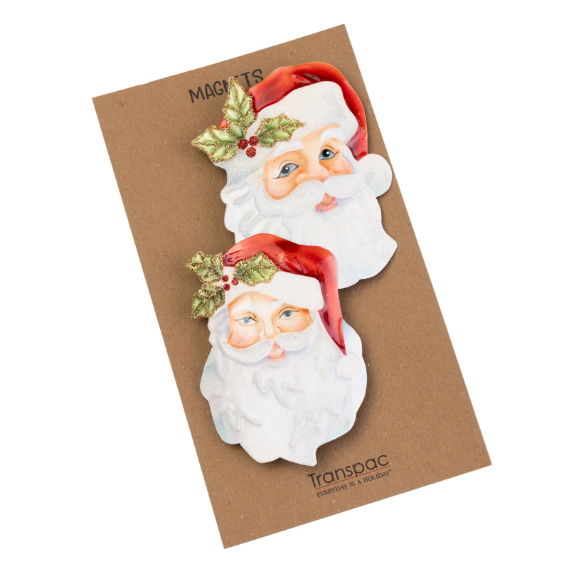Two Santa Claus magnets on a Transpac packaging with a brown background