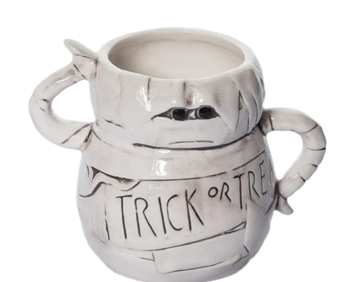 White ceramic mummy mug with 'Trick or Treat' text on a white background