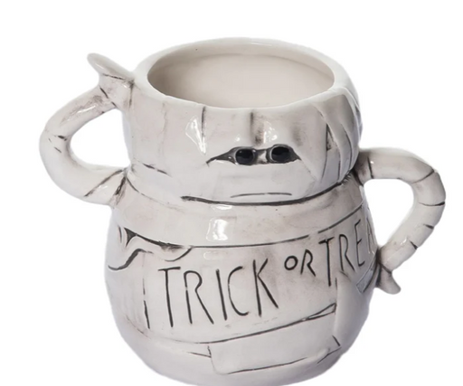 White ceramic mummy mug with 'Trick or Treat' text on a white background
