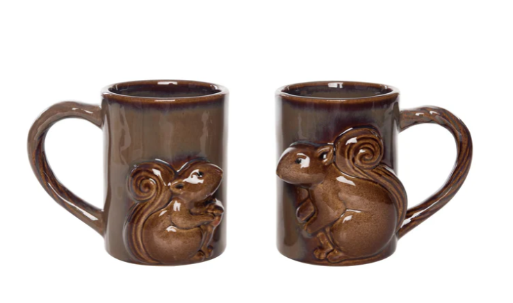 Two brown ceramic mugs with squirrel designs on a white background