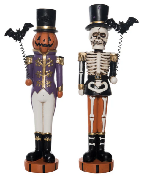 Halloween-themed nutcracker figurine with skeleton and pumpkin design on a white background
