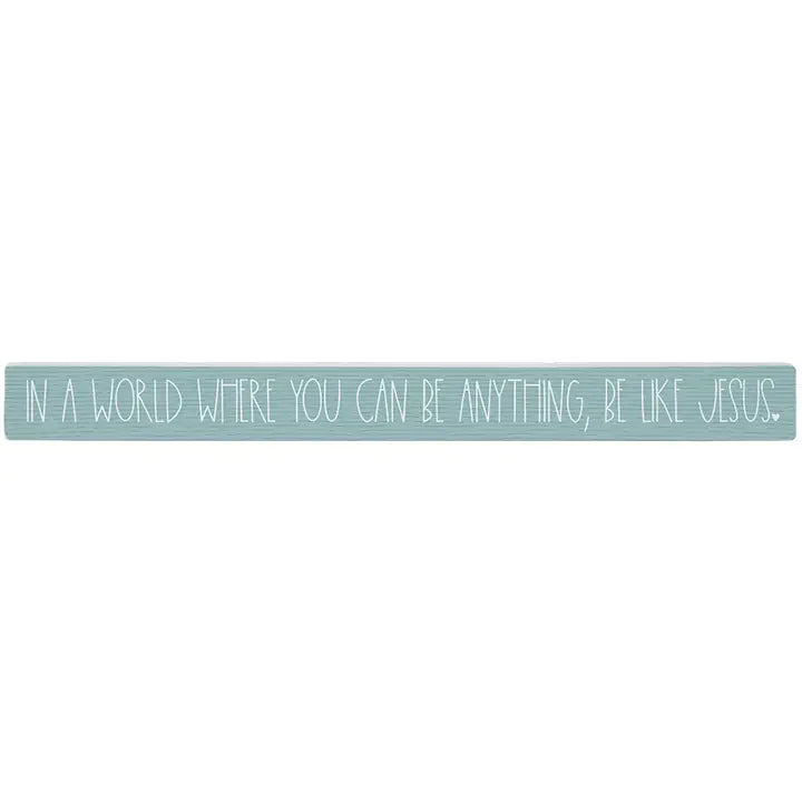Motivational quote 'In a world where you can be anything, be like Jesus' on a light blue background