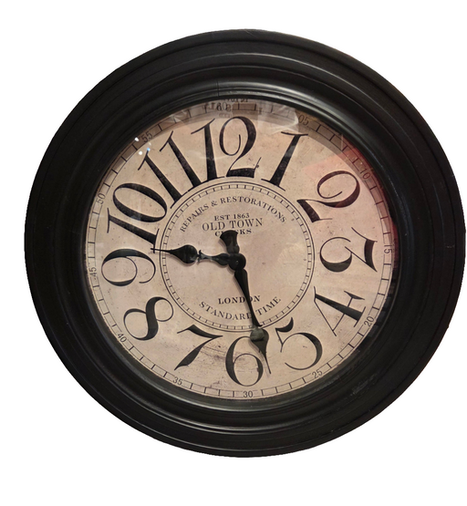 Round wall clock with black frame and beige face on a white background