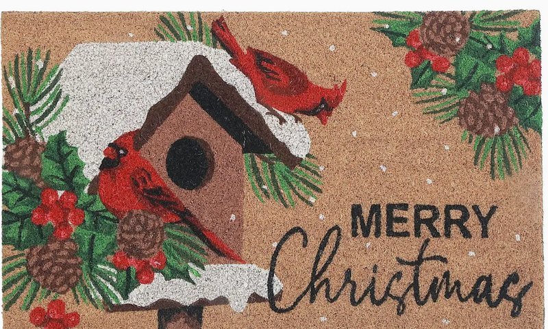 Christmas-themed doormat with cardinals, birdhouse, and 'Merry Christmas' text on a brown background.