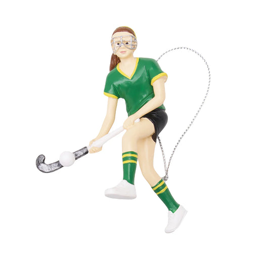 Figurine of a hockey player in green and black uniform with a stick on a white background