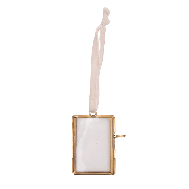Gold rectangular photo frame with a white ribbon on a white background