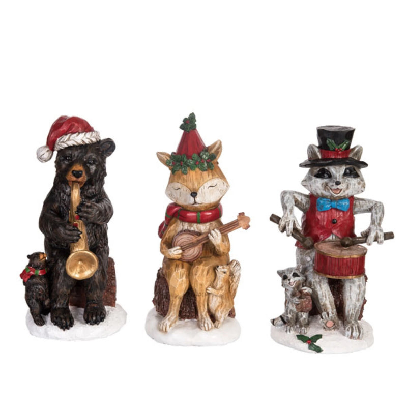 Three festive animal figurines: a bear, fox, and raccoon playing musical instruments on a white background.
