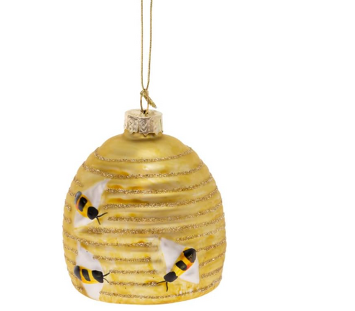 Decorative glass ornament shaped like a beehive with bees on a white background