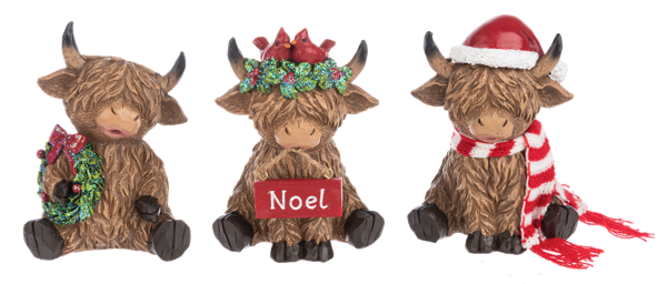 Three Holiday Highland Cow figurines, each wearing different Christmas-themed decorations, from left to right: one with a Santa hat, one with a reindeer antler, and one with a Christmas tree.