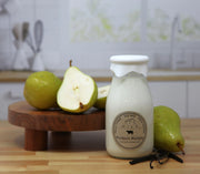 Glass bottle labeled 'Farmers Market' with pears on a wooden surface