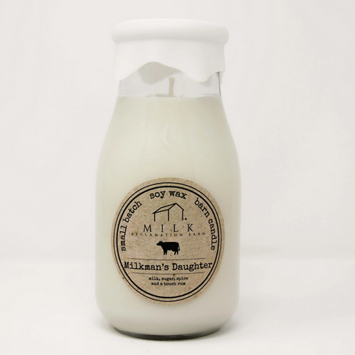 Candle in a glass jar with a label on a white background