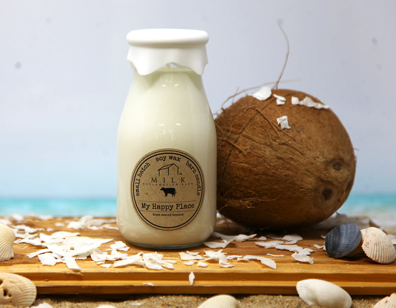Milk bottle labeled 'My Happy Place' with a coconut and seashells on a beach-themed background