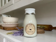 Milk bottle with a label on a kitchen counter