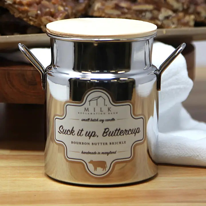 Metallic container with a label on a wooden surface