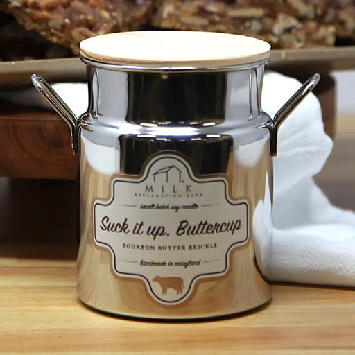 Metallic container with a label on a wooden surface