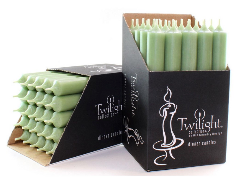 Green candles in black Twilight packaging on a white background